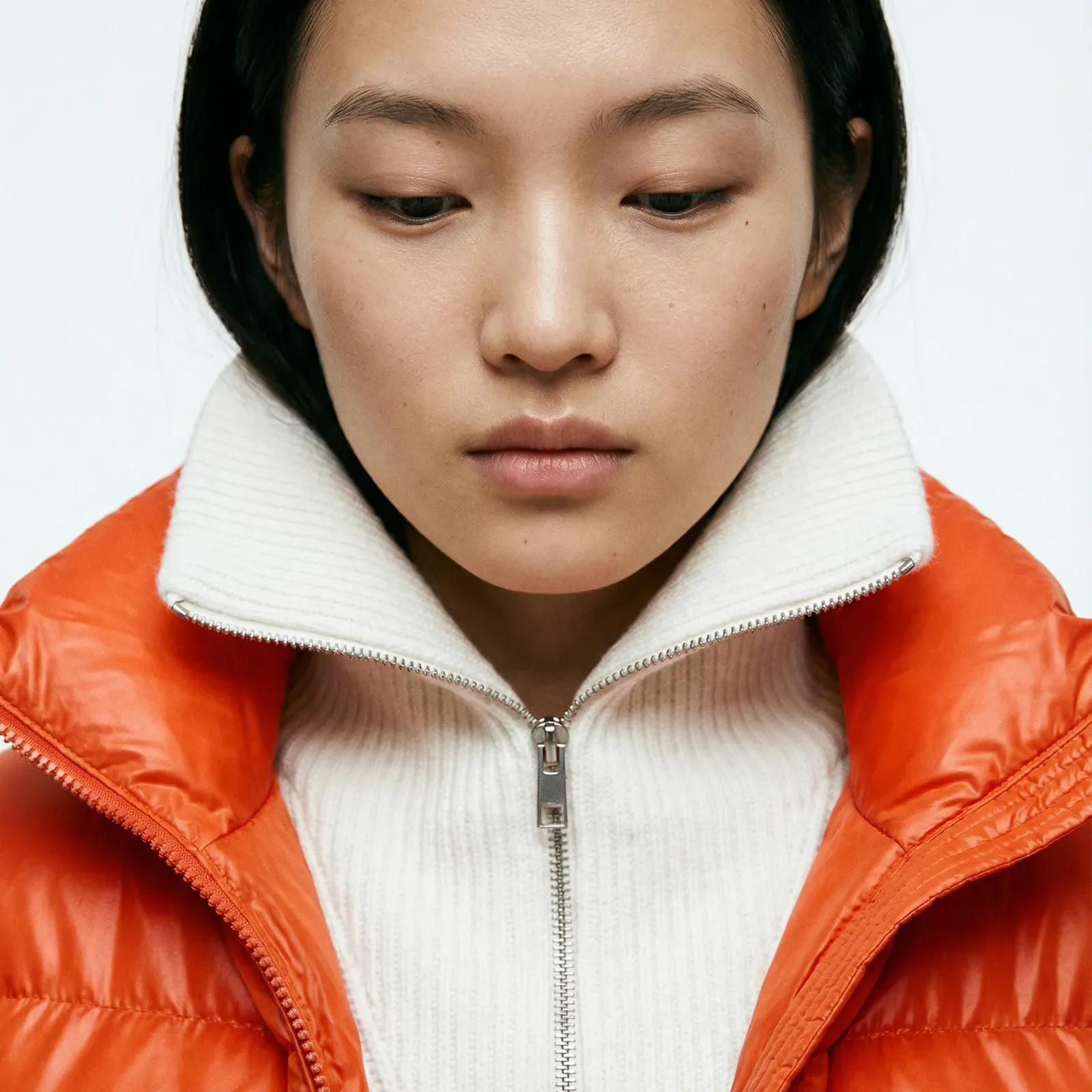 Portrait in an orange jacket from the Novus photography direction